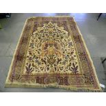 A LUSTROUS WOOL BEIGE GROUND RUG