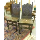 A PAIR OF CARVED AND DARK STAINED OAK PANEL BACK CHAIRS BEARING THE SPURIOUS DATE 16/68