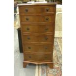 A REPRODUCTION MAHOGANY SERPENTINE CHEST OF DRAWERS