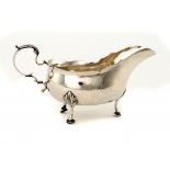 A GEORGE III SILVER CREAM BOAT  15.5cm l, engraved with the initials H/IF and at later date on the