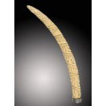 TRIBAL ART. A VILI CARVED IVORY ELEPHANT TUSK, LOANGO, 1870S-1920S  carved with a spiral of ninety