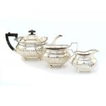 A GEORGE V SILVER TEA SERVICE  teapot 15cm h, by Barker Bros Silversmiths Ltd, Chester 1918,