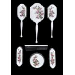 AN ELIZABETH II SILVER AND ENAMEL BRUSH SET  painted with roses on an eau de nil guilloche enamel