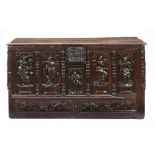 A FRENCH  OAK CHEST, NORMANDY, C1500-1550  the front carved with the Virgin and Child and four