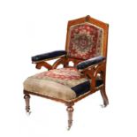 A VICTORIAN REFORMED GOTHIC OAK AND INLAID ARMCHAIR, C1870  in the original turkey pattern