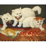 A VICTORIAN RAISED WOOLWORK PICTURE OF THREE CATS, C1860  each kitten with glass eyes, mounted as