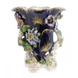 A DERBY NATURALISTIC COBALT GROUND FLORAL ENCRUSTED VASE, C1830  on four rustic gilt feet, 16cm h,