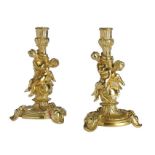 A PAIR OF FRENCH ORMOLU CANDLESTICKS AFTER A DESIGN BY  JUSTE-AURÈLE MEISSONNIER, 19TH C  23cm h++