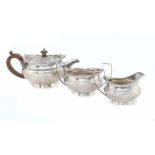 A GEORGE III SILVER TEA SERVICE  the teapot with integral hinge and engraved Greek key border,