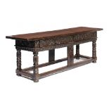 AN INTERESTING CONTINENTAL OAK REFECTORY TABLE, EARLY-MID 17TH C   with substantial one plank top,