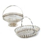 A VICTORIAN SILVER FLUTED OVAL FRUIT BASKET AND A GEORGE V SILVER FRUIT BASKET  26cm w and 23.5cm