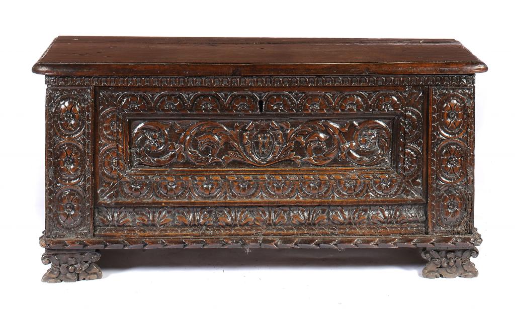 AN ITALIAN WALNUT ARMORIAL CASSONE, LATE 16TH C  the deeply carved and panelled front with central