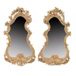 A PAIR OF VICTORIAN GILTWOOD AND COMPOSITION CARTOUCHE SHAPED MIRRORS IN GEORGE III STYLE, C1860