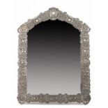 A VICTORIAN SILVER MIRROR  the elaborately decorated openwork frame with putti, hearts and flowers