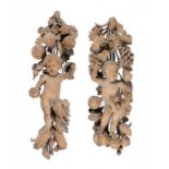 A PAIR OF ENGLISH LIMEWOOD CARVINGS OF PUTTI IN THE MANNER OF GRINLING GIBBONS, LATE 17TH C with