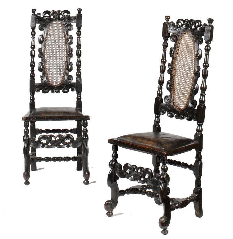 A PAIR OF WILLIAM III EBONISED AND CANED CHAIRS, C1700  123cm h++Later drop in padded seats, black