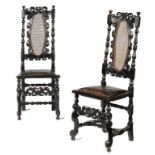 A PAIR OF WILLIAM III EBONISED AND CANED CHAIRS, C1700  123cm h++Later drop in padded seats, black