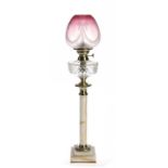 AN EDWARD VII BRASS MOUNTED ONYX COLUMNAR OIL LAMP, C1905  with cut glass fount, brass burner and