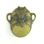 A BRONZE PIN CUSHION IN THE FORM OF A JAPANESE MASK, 19TH/EARLY 20TH C