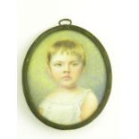 ENGLISH SCHOOL, C1900 PORTRAIT MINIATURE OF A YOUNG CHILD, IVORY, OVAL, GILTMETAL FRAME