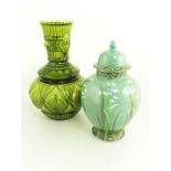 A LEAR OLIVE GREEN MAJOLICA GLAZE VASE IN THE STYLE OF DR CHRISTOPHER DRESSER AND A WOOD & SONS