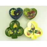 FOUR MOORCROFT HEART OR CLUB SHAPED DISHES