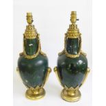 A PAIR OF FRENCH ORMOLU MOUNTED AND GREEN PAINTED METAL NEO CLASSICAL STYLE VASES, MOUNTED AS LAMPS,