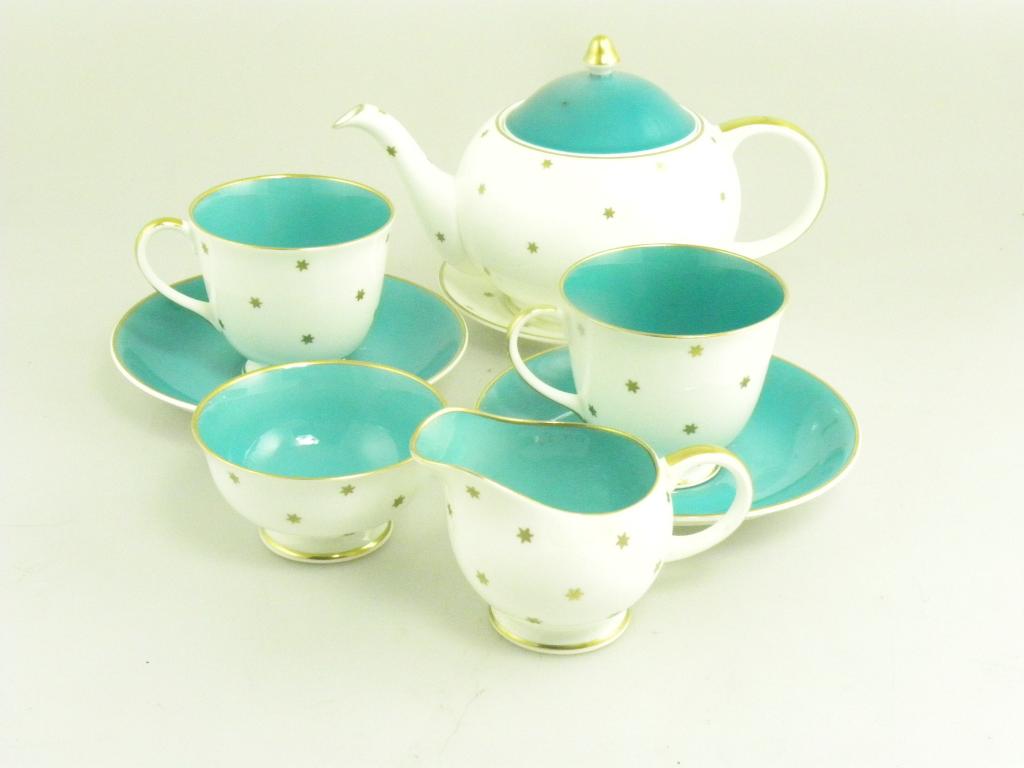 A SUSIE COOPER TEA SET FOR TWO, TEAPOT CRACKED