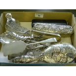 TWO PAIRS OF EPNS ASPARAGUS OR OTHER SERVERS, A SILVER HAND MIRROR AND TWO BRUSHES EMBOSSED WITH