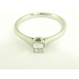 A DIAMOND SOLITAIRE RING, WITH EMERALD CUT DIAMOND, IN PLATINUM, 3.2G, SOLD WITH GIA REPORT NO: