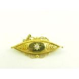 A DIAMOND GYPSY SET NAVETTE SHAPED BROOCH IN GOLD, MARKED 15CT, 6.5G