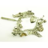 A SILVER CHARM  BRACELET, 2 OZS 10 DWTS