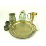 AN EDWARDIAN EPNS MOUNTED GLASS INKWELL OF LOBED OVIFORM DESIGN, A PAIR OF SILVER NAPKIN RINGS AND