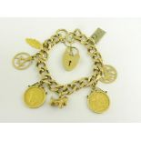 A GOLD CHARM BRACELET, THE CHARMS INCLUDING TWO HALF SOVEREIGNS 1913 AND 1914, 57G