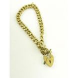 A GOLD CURB BRACELET AND PADLOCK, 11G
