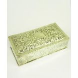 A VICTORIAN SILVER EMBOSSED AND ENGRAVED CIGARETTE BOX, CEDAR LINED, LONDON 1887