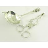 A PAIR OF GEORGE III SILVER SUGAR NIPS, LONDON CIRCA 1770 AND A SILVER TEA STRAINER WITH SAW PIERCED