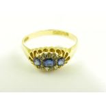 A SAPPHIRE AND DIAMOND RING WITH THREE LARGER SAPPHIRES, IN 18CT GOLD, BIRMINGHAM 1902, 3.7G