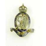 A TWO COLOUR GOLD AND ENAMEL BROOCH IN THE FORM OF THE INSIGNIA OF THE ROYAL HORSE ARTILLERY,