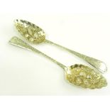 A PAIR OF GEORGE III SILVER TABLESPOONS, LATER CHASED AND GILT AS BERRY SPOONS, LONDON 1806, 4OZS