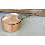 A VICTORIAN COPPER SAUCEPAN AND LID WITH IRON HANDLES