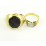 A 9CT GOLD GENTLEMAN'S SIGNET RING WITH ONYX INTAGLIO AND A DIAMOND SOLITAIRE RING, ILLUSION SET