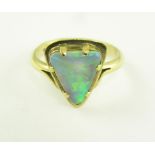 A 9CT GOLD RING SET WITH A TRIANGULAR SHAPED OPAL OR OPAL DOUBLET, 4.7G