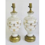 A PAIR OF BRASS MOUNTED GILT OPAL GLASS VASES MOUNTED AS TABLE LAMPS