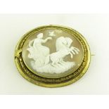 A VICTORIAN CAMEO BROOCH, THE OVAL SHELL CARVED WITH A CLASSICAL WOMAN IN A CHARIOT ON CLOUDS, IN