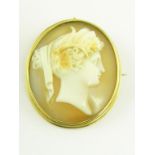 A VICTORIAN CAMEO BROOCH, THE OVAL SHELL CARVED WITH A CLASSICAL BUST, IN GOLD MOUNT