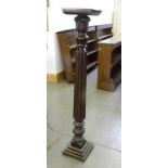 A WILLIAM IV MAHOGANY TORCHERE (ADAPTED FROM A BEDPOST)