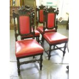 A SET OF FOUR VICTORIAN CARVED AND DARK STAINED OAK DINING CHAIRS WITH PADDED SPLAT