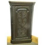 A VICTORIAN ANTIQUARIAN STYLE CARVED OAK CORNER CUPBOARD