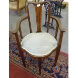 AN EDWARDIAN MAHOGANY AND LINE INLAID ELBOW CHAIR WITH PADDED SEAT